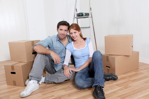 Local moving truck loaded with household furniture in central London