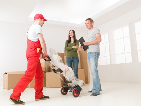 Professional movers handling furniture carefully
