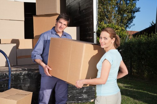 Removal team loading furniture in a central London street